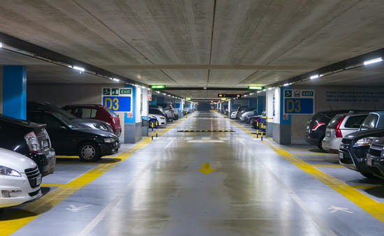 Cars parked in clean parking garage