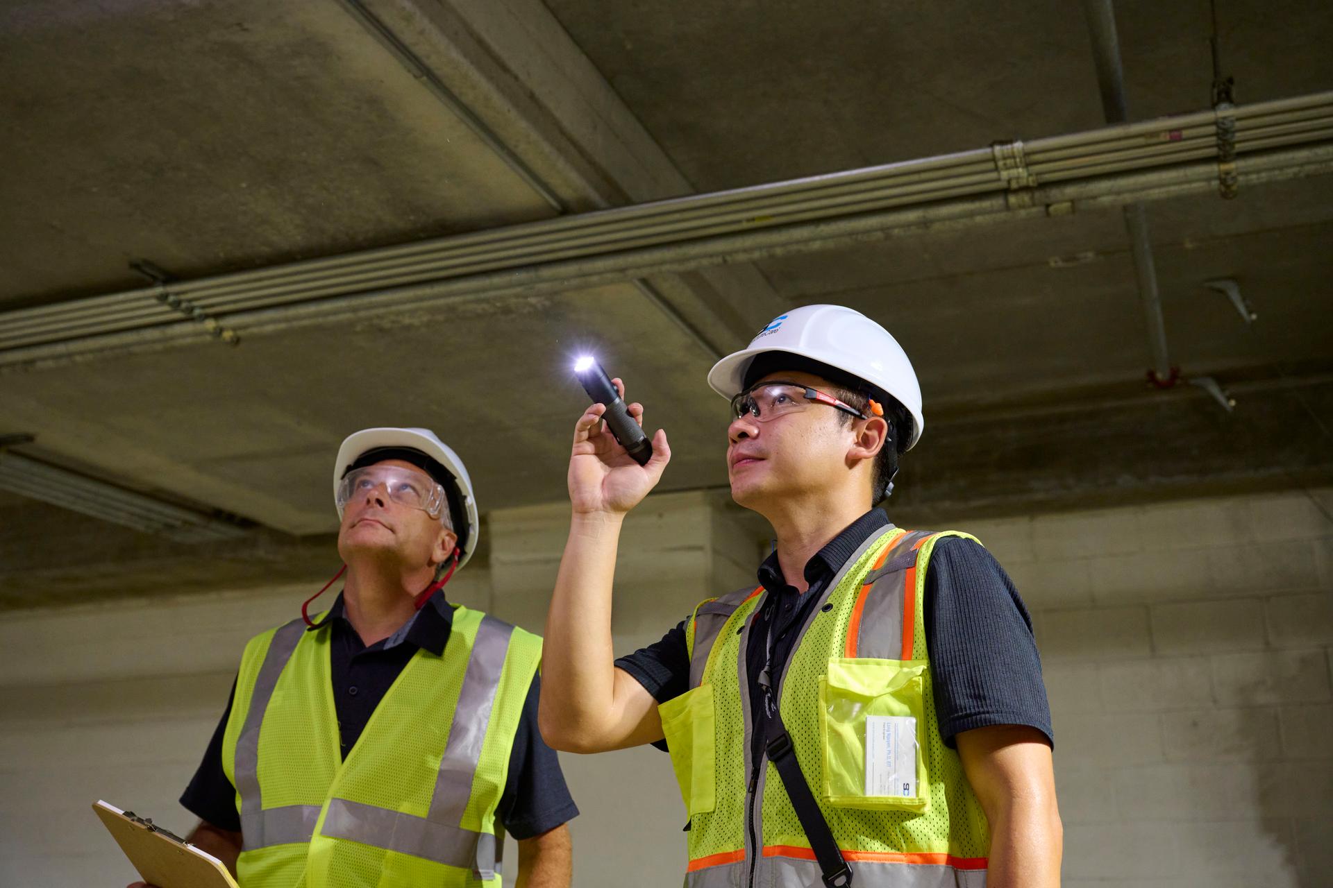 Two engineers discussing structural health
