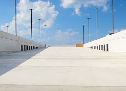Parking garage ramp with blue sky in background