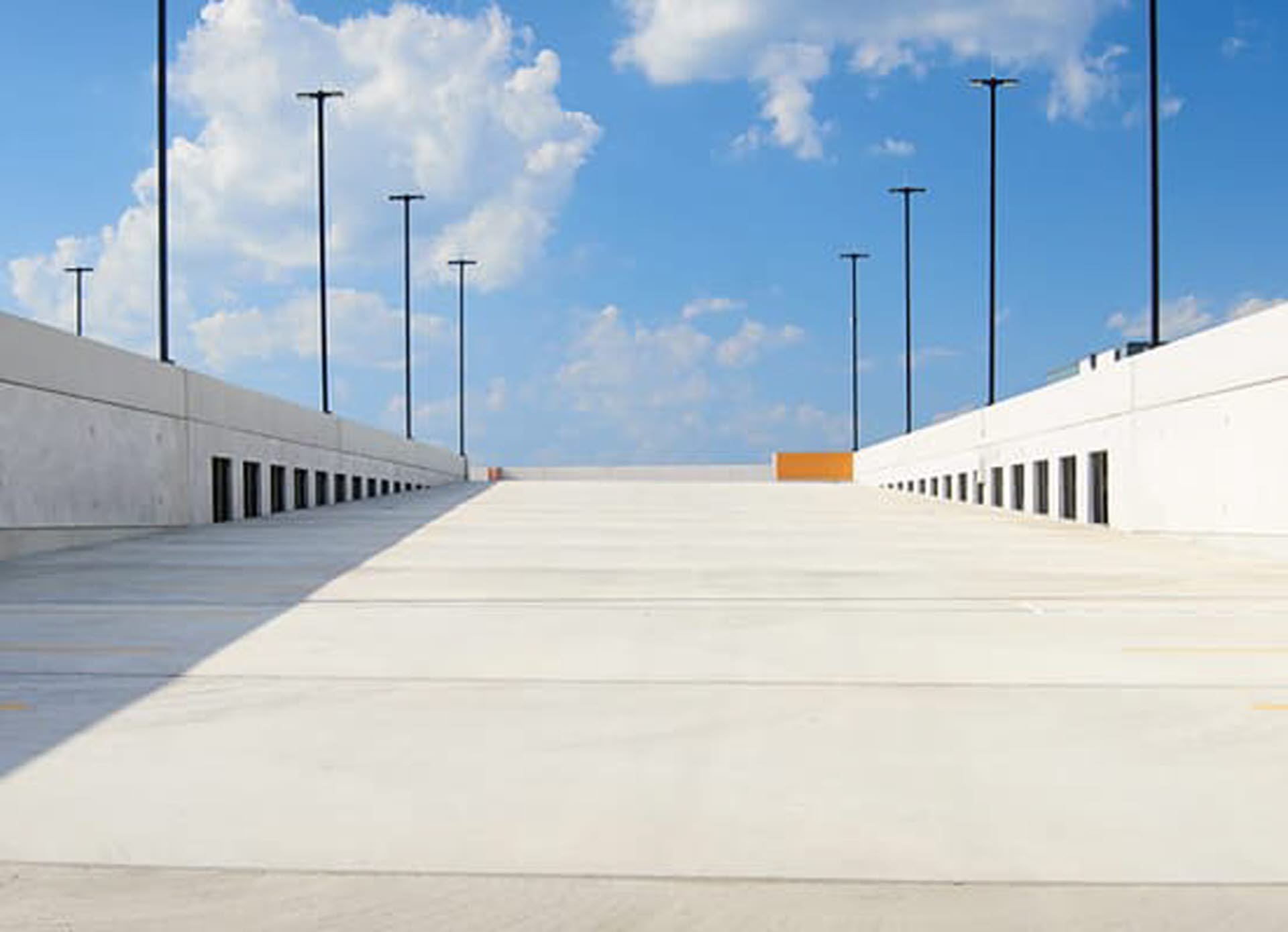 Parking garage ramp with blue sky in background