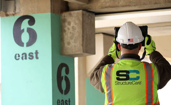 Structural engineer inspecting parking garage