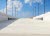 Parking garage ramp with blue sky in background