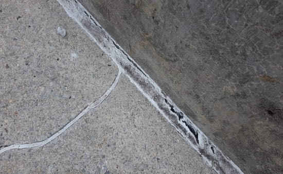 Cracked caulking in parking garage concrete