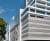 Mixed-use parking garage against blue sky