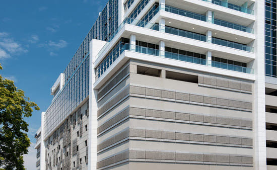 Mixed-use parking garage against blue sky